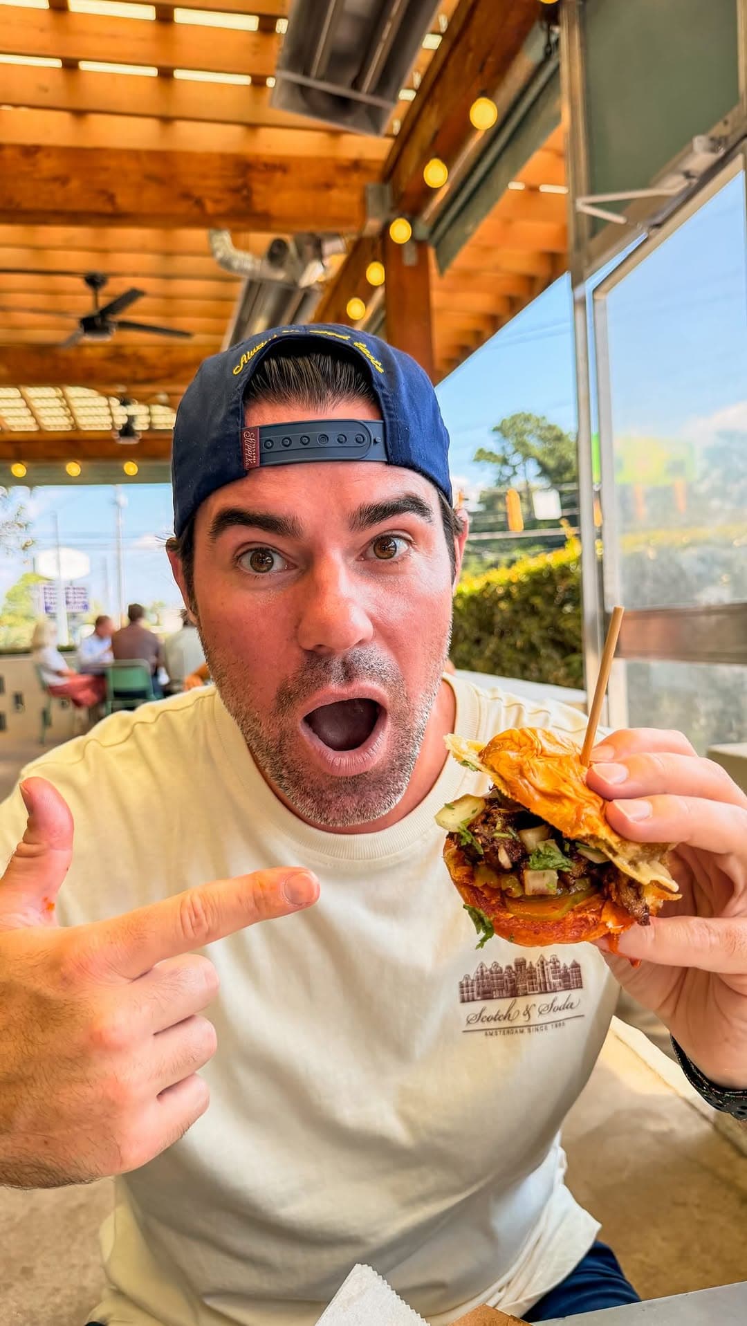 Surprised reaction holding a limited-run sandwich at Little Rey in Atlanta.